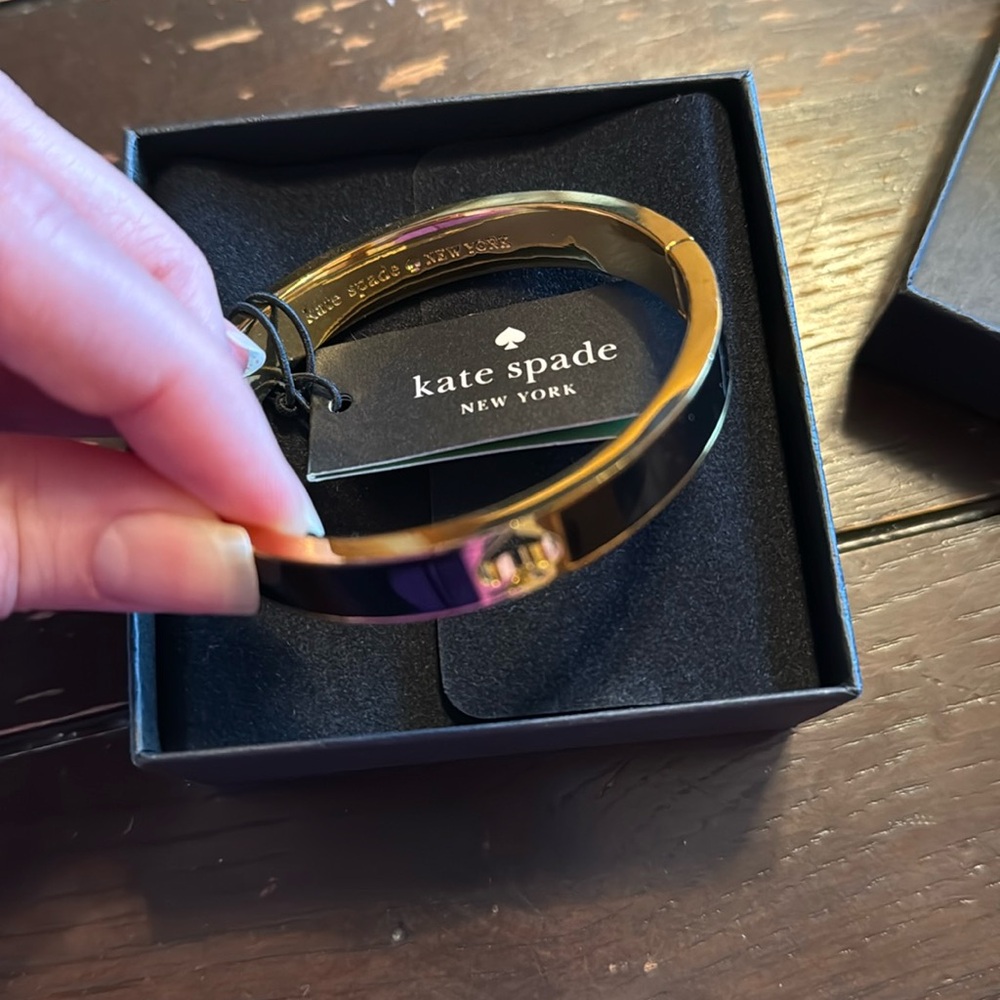 NWB Kate Spade black and gold bracelet Hole punch brand new